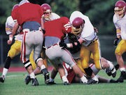 Football Leads in College Sports Injuries, But Wrestling Most Dangerous